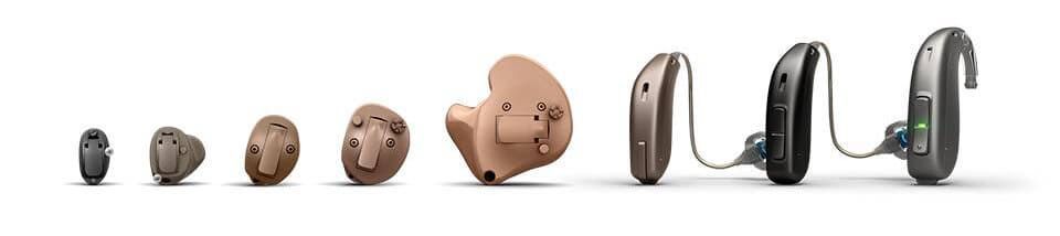 A row of different Oticon hearing aid styles side by side